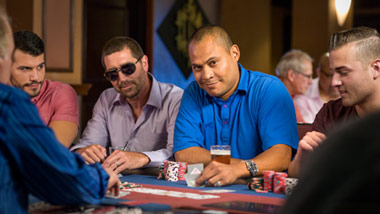 group of men playing poker